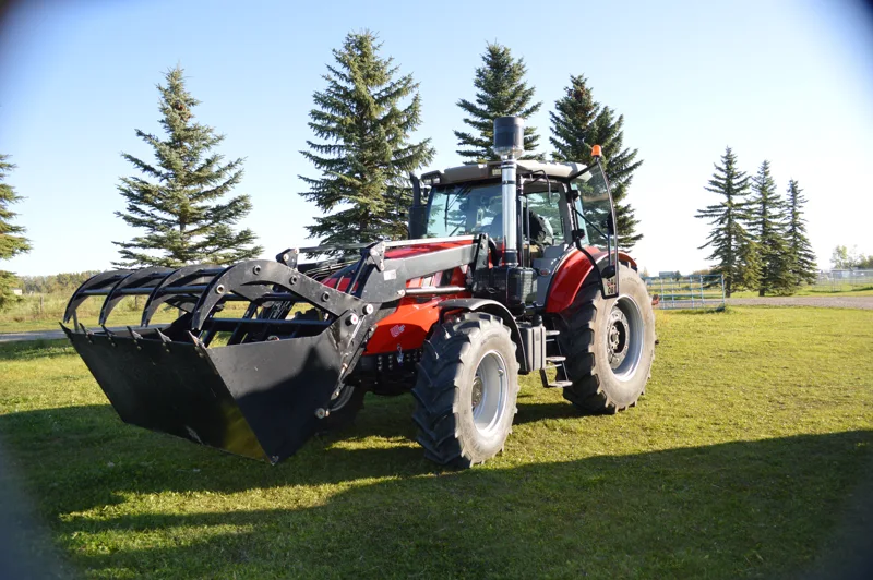 Close view of a URSA tractor and grapple bucket